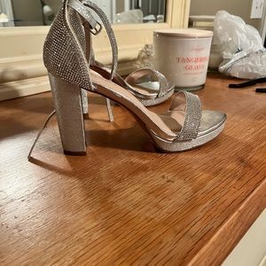 Silver badazzled heels .